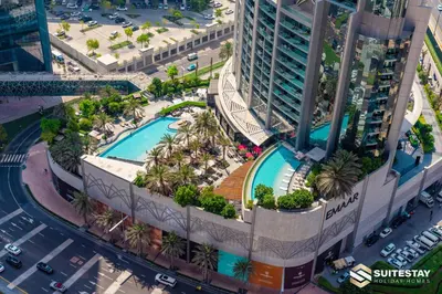 an overhead view of a building with a swimming pool at Dubai Mall Apartments by Suitestay in Dubai