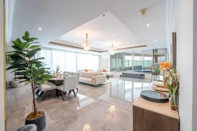 a living room with a couch and a table at Marina Luxury 5 Bedroom & Private Pool in Dubai