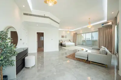 a living room with a couch and a table at Marina Luxury 5 Bedroom & Private Pool in Dubai