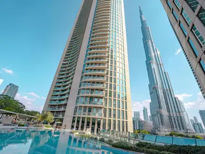a tall building with a pool in front of a city at Full Burj Khalifa Views at Burj Vista in Dubai