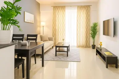 a living room with a couch and a table at 1 Bhk Huge Apartment In Heart of Dubai Marina in Dubai