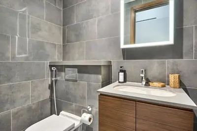 a bathroom with a sink and a mirror at STAY BY LATINEM Luxury 1BR Holiday Home CC 0821 Near Downtown in Dubai