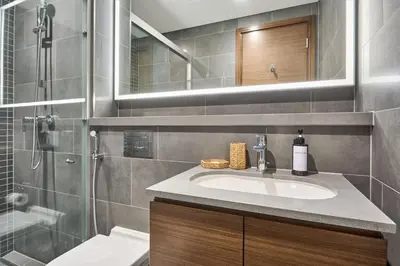 a bathroom with a sink and a shower at STAY BY LATINEM Luxury 1BR Holiday Home CC 0821 Near Downtown in Dubai