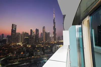 a view of a city skyline from a window at Studio with Burj Khalifa view in Dubai