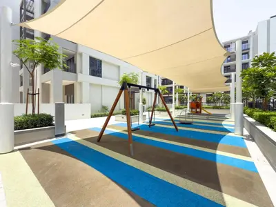 a playground in the courtyard of a building at GuestReady - Blue Bliss l 2Bed l Lagoon Escape in Dubai