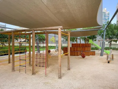 a park with a playground with a swing at Luxury 2BR with Burj Khalifa Views l Near Dubai Mall in Dubai