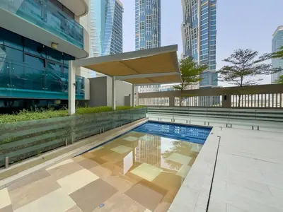 a swimming pool in a city with tall buildings at DAYF-MER Stylish 1Bed in central location Business Bay in Dubai