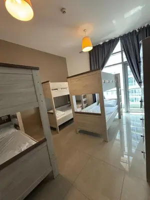 a room with two bunk beds and a window at LYO guest house Dubai marina BEDSPACE in Dubai