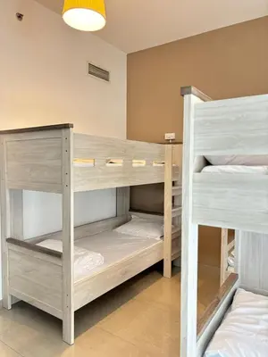 a room with two bunk beds in it at LYO guest house Dubai marina BEDSPACE in Dubai