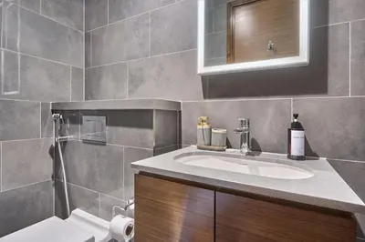 a bathroom with a sink and a toilet at STAY BY LATINEM Luxury 1BR Plus Study Holiday Home CB 1013 Near Burj Khalifa in Dubai