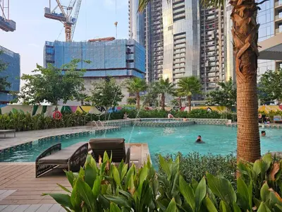 a swimming pool in the middle of a city at Modern New Studio with Panoramic View in Business Bay in Dubai
