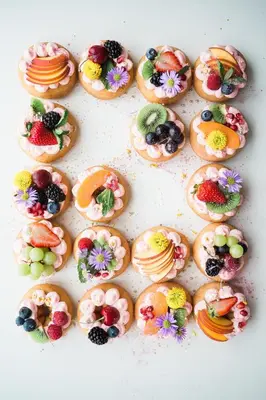 a bunch of donuts with fruit on them at Private Pool Paradise Villa! Dubai Mall in a Flash! Complimentary Full Mid-Stay Refresh for 1 week stay in Dubai