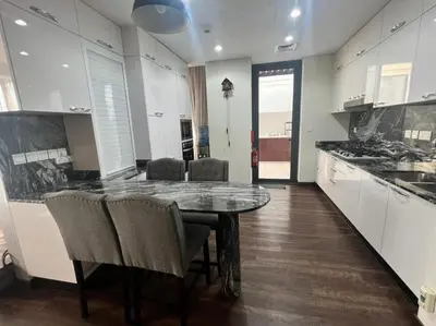 a kitchen with a table and chairs in a room at Private room in a luxury villa at Dubai hills in Dubai