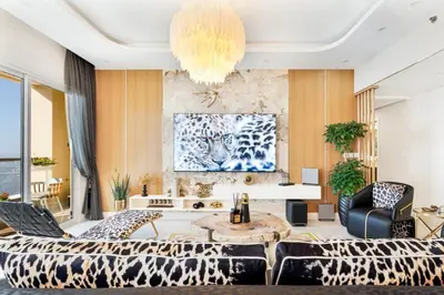 a living room with a couch and a table at Luxury 2-Bedroom with Sea & Ain Dubai View in Dubai