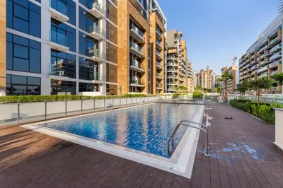 a swimming pool in the middle of a building at Charming 1-Bedroom Close to Downtown in Dubai