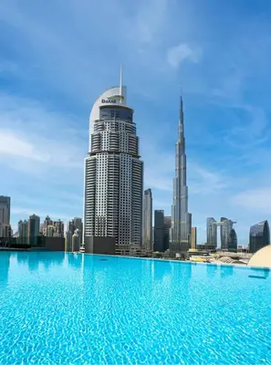 a view of a city skyline from a swimming pool at Iconic Address 1BR Above Dubai Mall by Maxx value homes in Dubai