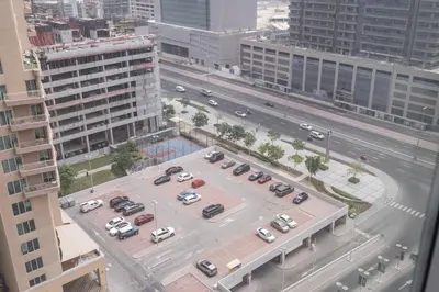 an aerial view of a parking lot with cars at Chic Studio at ME DO RE Tower Stunning Views in Dubai