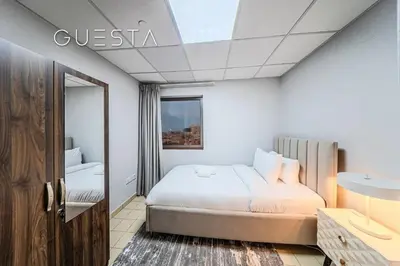a hotel room with a bed and a window at Jumeirah Beach Residence - Murjan 5, Dubai Marina in Dubai