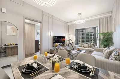 a living room and dining room with a table and chairs at Luxury 1BHK Burj Khalifa & Canal View in Dubai