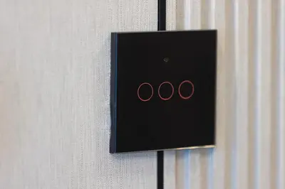 a lightswitch on a wall with the word oo at Luxury 1BHK Burj Khalifa & Canal View in Dubai