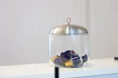 a glass jar with a bunch of shoes in it at Luxury 1BHK Burj Khalifa & Canal View in Dubai