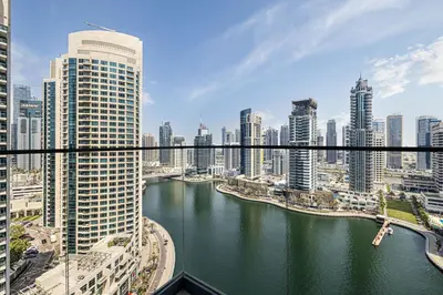 a view of a river in a city with tall buildings at Daniels 2BR with Maid Room at Liv Residency with Marina View in Dubai