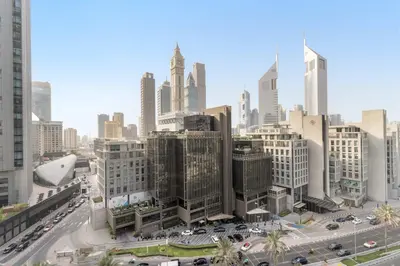 a view of a city with cars and buildings at Silkhaus Luxury Studio at Sky Gardens in DIFC Views in Dubai