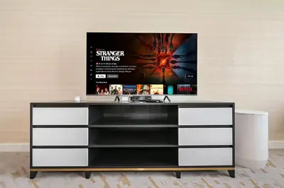 a dresser with a poster of a movie at NEW Luxury studio - Amazing Palm Views in Dubai