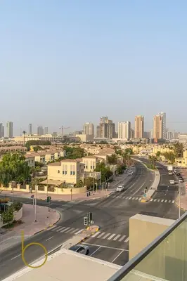 a view of a city street with buildings at Bookable - Studio Room, Bali Residences JVT in Dubai