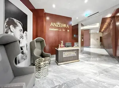 a dressing room with a woman on a wall at BLVD - Luxury Stay with Burj Khalifa View in Dubai