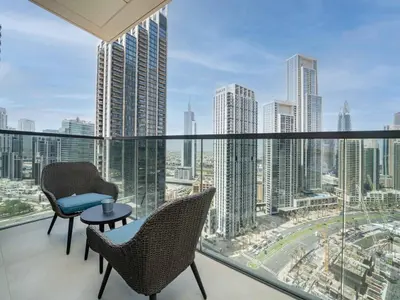 a balcony with chairs and a view of the city at Stunning 2 bed dubai mall burj khalifa downtown ACT 1 in Dubai