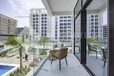 an apartment balcony with a view of the city at Bloomfields Supreme Stu In Azizi Riviera in Dubai