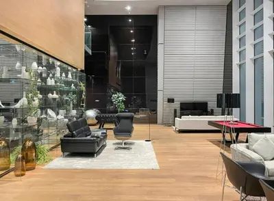a lobby with couches and chairs in a building at DIFC Index Tower Burj Khalifa View 1BR in Dubai