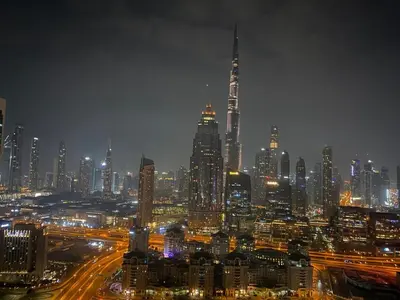a nighttime view of a large city at night at DIFC Index Tower Burj Khalifa View 1BR in Dubai