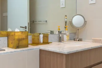 a bathroom counter with a sink and a mirror at Port de la Mer Luxury Sleeps 4Person in Dubai