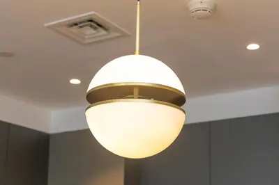 a light hanging from the ceiling in a room at Port de la Mer Luxury Sleeps 4Person in Dubai