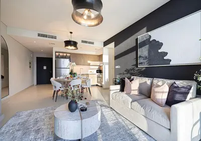 a living room with a couch and a table at Luxury Burj Crown Suites by Maison Aurora in Dubai