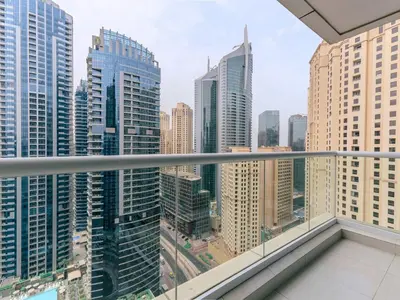 a view of a city from a balcony in a skyscraper at Continental Tower Luxury 2BR Dubai Marina Views in Dubai
