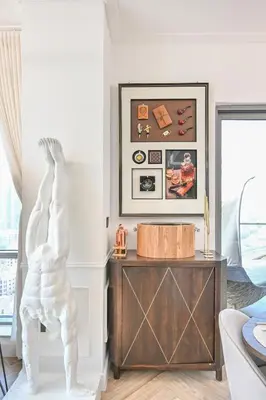 a living room with a white statue on a table at Stunning 2 Bdr Luxury Burj Khalifa view in Dubai