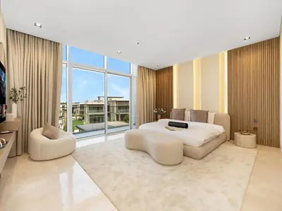 a large bedroom with a bed and a large window at Dubai Hills Mansion Cinema, Gym & Luxe Pool in Dubai