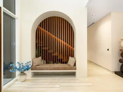 a bench in a hallway with a window at Dubai Hills Mansion Cinema, Gym & Luxe Pool in Dubai