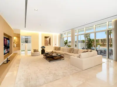 a large living room with a couch and a table at Dubai Hills Mansion Cinema, Gym & Luxe Pool in Dubai