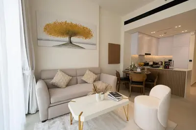 a living room with a couch and a table at Binghatti Amber in JVC, 15 Min to Marina in Dubai