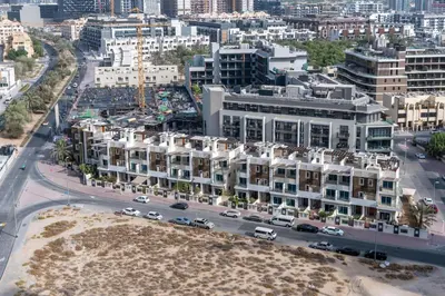 an aerial view of a city with buildings at White Sage Modern Studio in JVC with Balcony and City Views in Dubai