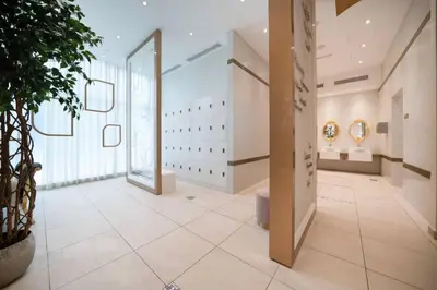 a hallway of a building with a large window at High-Floor Elegance | 1-Bedroom with Marina Views in Dubai