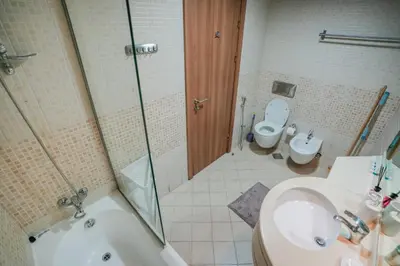 a bathroom with a shower and a sink and a toilet at Stylish 1BHK in Sulafa Tower at Dubai Marina in Dubai