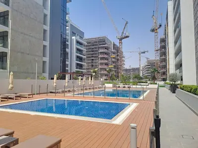 a swimming pool in the middle of a building at Azizi Riviera 61 - Serene Studio in Meydan in Dubai