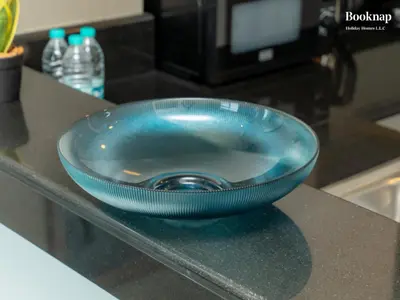 a blue bowl sitting on top of a counter at Luxury 1BHK Apartment at DAMAC Prive A, Business Bay in Dubai