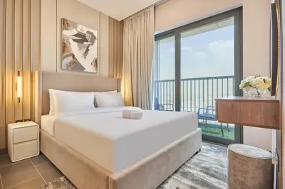a hotel room with a bed and a balcony at STAY BY LATINEM Luxury 1BR Holiday Home CB 2001 Near Burj Khalifa in Dubai