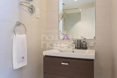 a bathroom with a sink and a mirror at Elegant Studio apartment in Avanti Tower Business Bay in Dubai